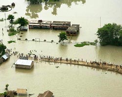 People reach for safer places in the flood affected area of Saharsa, near River Kosi in north Bihar
