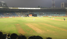 A cricket match in progress at Wankhede Stadium